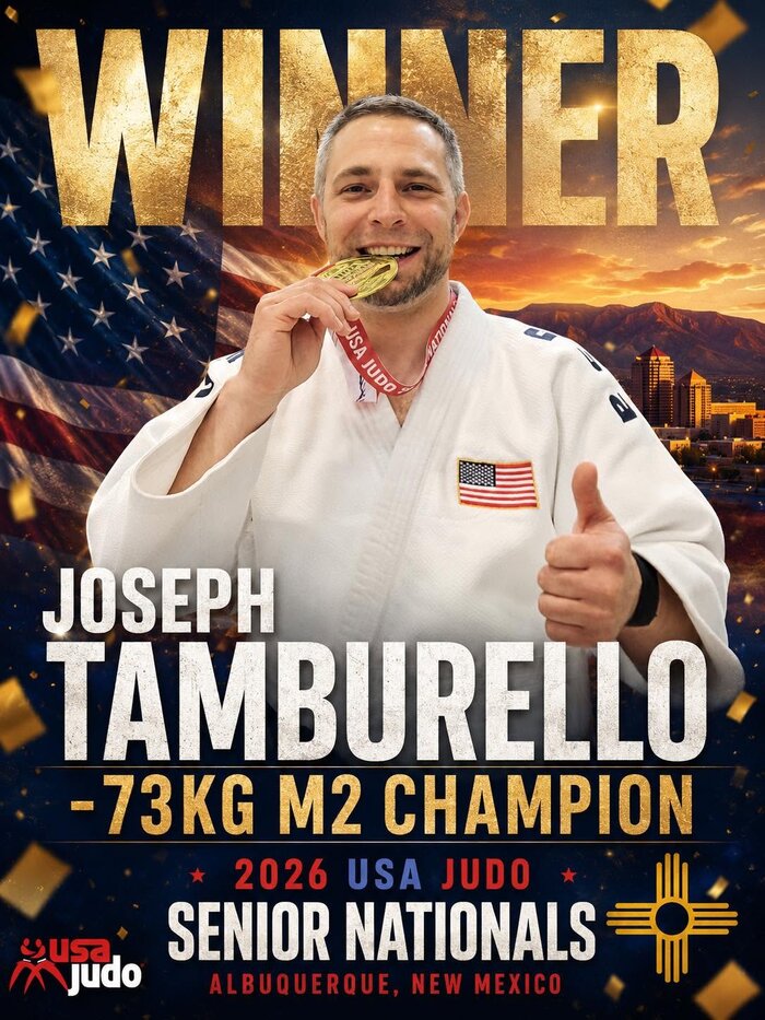 Joey Tamburello smiling and holding up a gold medal
